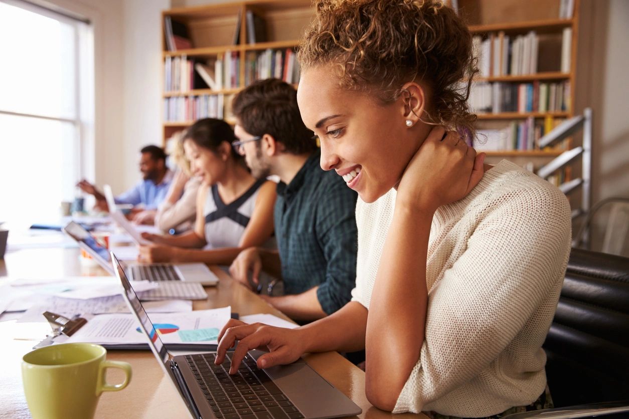 Photo of a woman using a laptop.